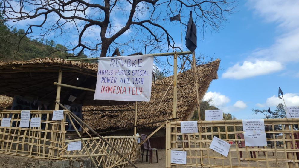 Black Flags and posters put up at the Konyak Community Morung on December 5 at Naga heritage Village, Kisama in protest against killing of civilians in Oting, under Mon district of Nagaland on December 4. (Morung Photo)